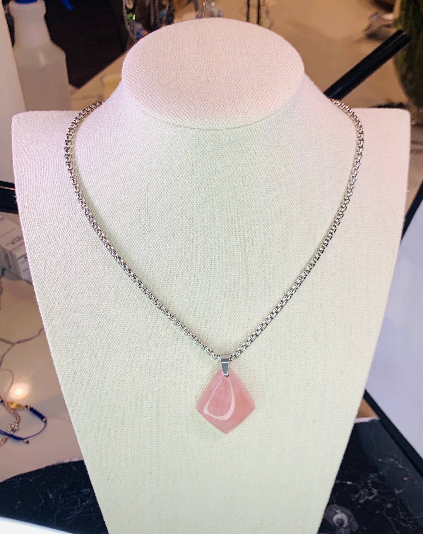 Natural Rose Quartz crystal pendant for love and self-love.